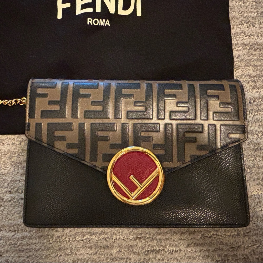 Fendi Black and Gold Clutch with Red Accent